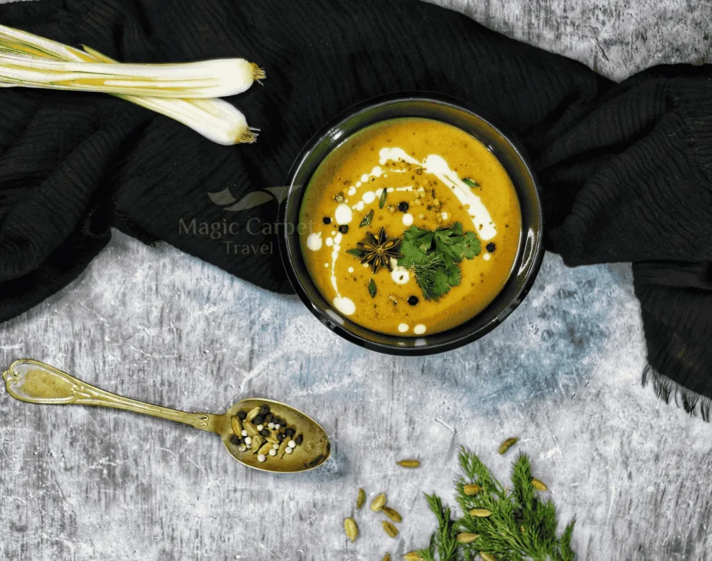 Egyptian traditional Lentil soup mixed with lemon and crunchy bread.