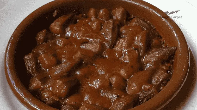 Bamia red sauce is a tomato-centered version of okra, stewed with garlic, tomato paste, and spices.